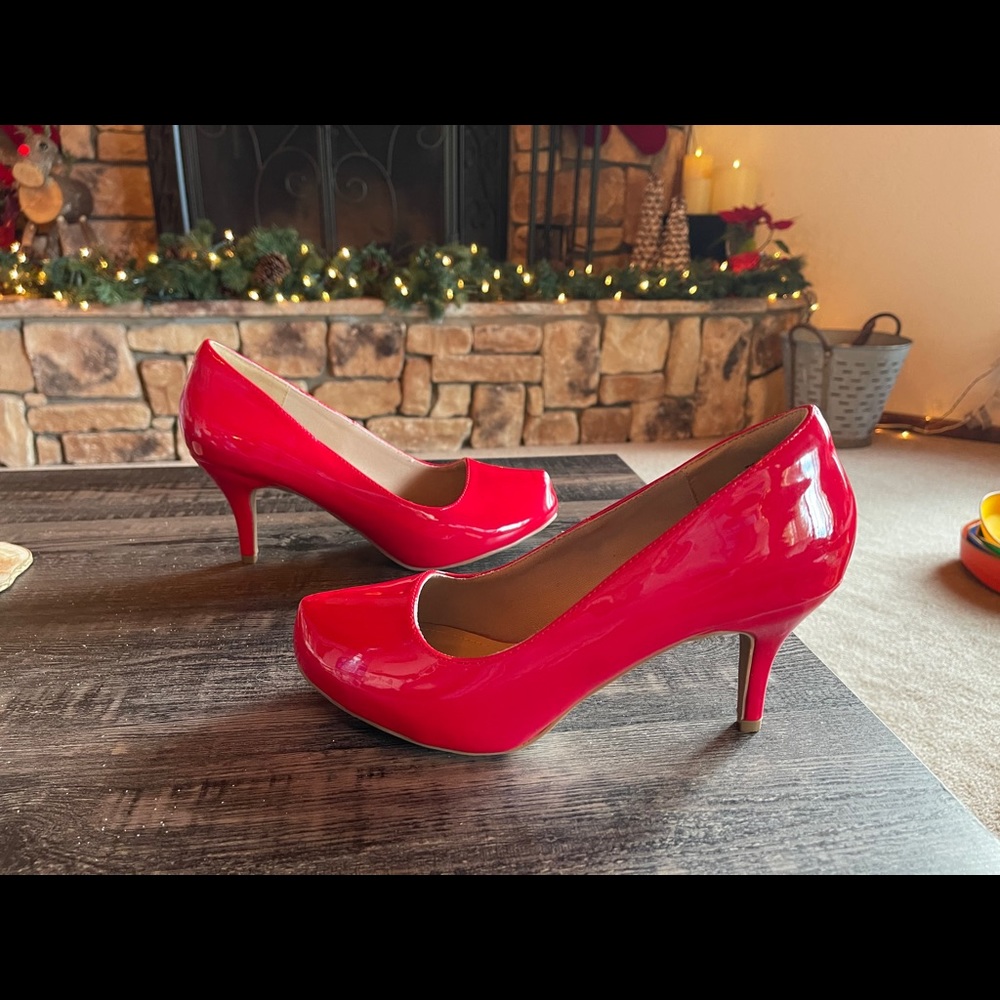 Never worn Red Patent leather pumps